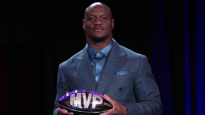 Feb 9, 2026; San Francisco, CA, USA; Seattle Seahawks running back Kenneth Walker III poses with the MVP trophy during the Super Bowl LX winning head coach and most valuable player press conference at Moscone Center. Mandatory Credit: Kirby Lee-Imagn Images