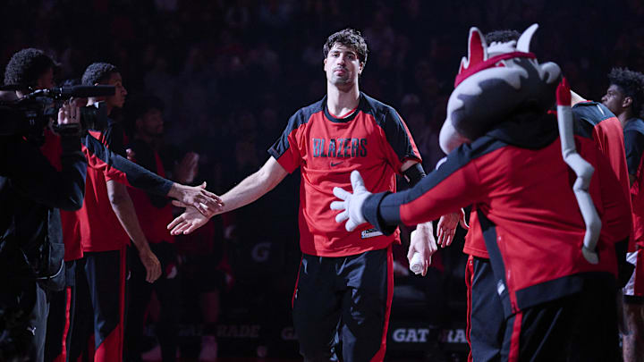 Mar 19, 2025; Portland, Oregon, USA; Portland Trail Blazers forward Deni Avdija (8) high fives teammates during introductions before a game against the Memphis Grizzlies at Moda Center. Mandatory Credit: Troy Wayrynen-Imagn Images
