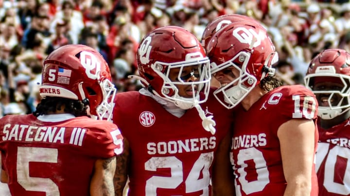 Oklahoma wide receiver Isaiah Sategna, running back Xavier Robinson, quarterback John Mateer Oklahoma wide receiver Isaiah Sategna, running back Xavier Robinson, quarterback John Mateer