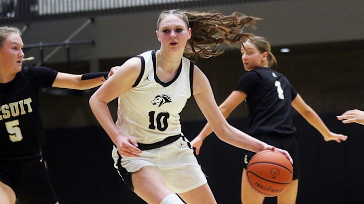 Mountainside senior Berlynn Carlson looks to drive against Jesuit senior Audrey Bayless, her former Crusaders teammate, during Friday’s game. Mountainside senior Berlynn Carlson looks to drive against Jesuit senior Audrey Bayless, her former Crusaders teammate, during Friday’s game.