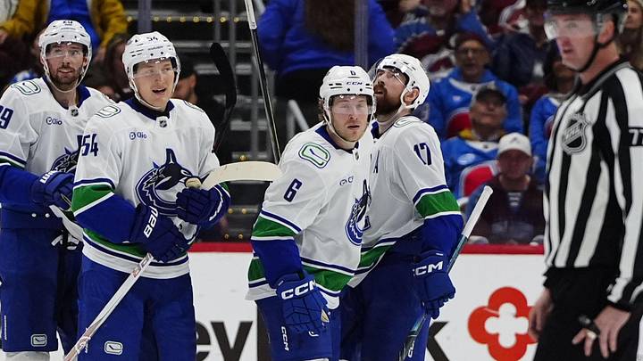 Apr 1, 2026; Denver, Colorado, USA; Members of the Vancouver Canucks celebrate a third period empty net goal by right wing Brock Boeser (6) against the Colorado Avalanche at Ball Arena. Apr 1, 2026; Denver, Colorado, USA; Members of the Vancouver Canucks celebrate a third period empty net goal by right wing Brock Boeser (6) against the Colorado Avalanche at Ball Arena.