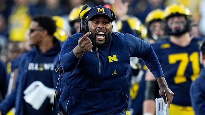 Michigan head coach Sherrone Moore challenges an incomplete pass intended for tight end Colston Loveland (not pictured) during the second half against Oregon at Michigan Stadium in Ann Arbor on Saturday, Nov. 2, 2024. Moore lost the challenge.