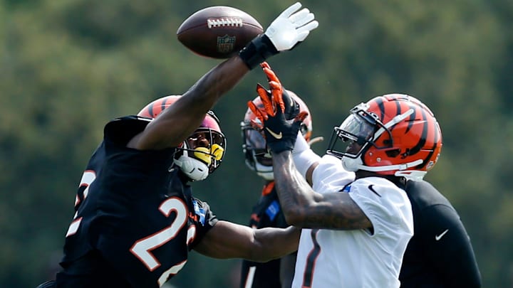 Bengals cornerback Chidobe Awuzie (22) breaks up a pass intended for wide receiver Ja'Marr Chase during practice.

Cincinnati Bengals Training Camp