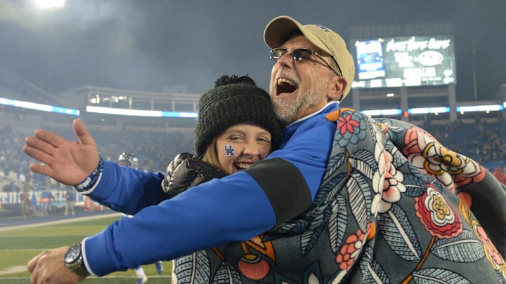 UK assistant head coach offense Eddie Gran hugs his daughter Lucy after the University of Kentucky football game against the University of Arkansas at Kroger Field in Lexington, Kentucky on Saturday, October 12, 2019.

Kentucky Football Arkansas