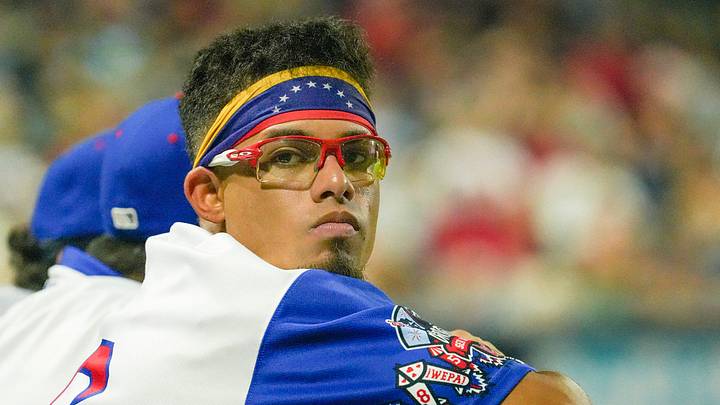 Franklin Arias watches WooSox teammates bat against Lehigh Valley August 4 at Polar Park.