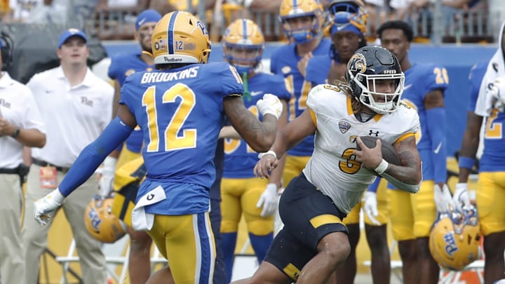 Aug 31, 2024; Pittsburgh, Pennsylvania, USA; Kent State Golden Flashes running back Ky Thomas (3) runs the ball as Pittsburgh Panthers defensive back Cruce Brookins (12) chases during the fourth quarter at Acrisure Stadium. Pittsburgh won 55-24.Mandatory Credit: Charles LeClaire-Imagn Images Aug 31, 2024; Pittsburgh, Pennsylvania, USA; Kent State Golden Flashes running back Ky Thomas (3) runs the ball as Pittsburgh Panthers defensive back Cruce Brookins (12) chases during the fourth quarter at Acrisure Stadium. Pittsburgh won 55-24.Mandatory Credit: Charles LeClaire-Imagn Images