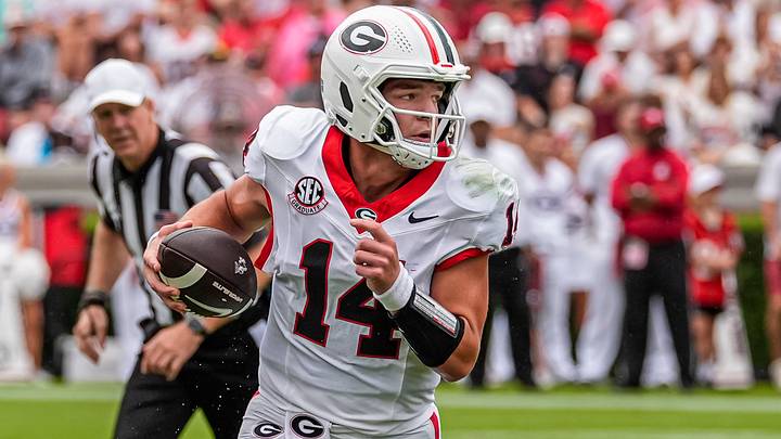 Sep 12, 2026; Athens, Georgia, USA; Georgia Bulldogs quarterback Gunner Stockton (14) rolls out and runs against the Western Kentucky Hilltoppers during the first half at Sanford Stadium. Mandatory Credit: Dale Zanine-Imagn Images