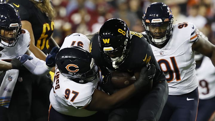 Andrew Billings tries to bring down Washington running back Brian Robinson Jr.  last season in a 40-20 Bears win.