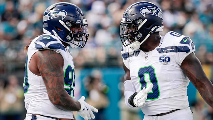 Oct 12, 2025; Jacksonville, Florida, USA; Seattle Seahawks defensive end Leonard Williams (99) and linebacker DeMarcus Lawrence (0) celebrate after a play against the Jacksonville Jaguars at EverBank Stadium. Oct 12, 2025; Jacksonville, Florida, USA; Seattle Seahawks defensive end Leonard Williams (99) and linebacker DeMarcus Lawrence (0) celebrate after a play against the Jacksonville Jaguars at EverBank Stadium.
