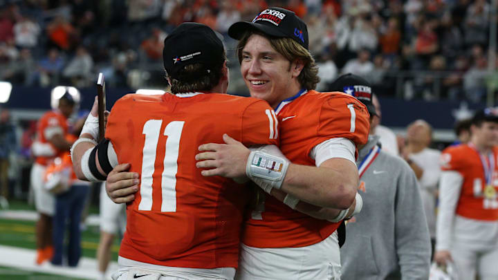 Celina's Luke Biagini (11), the defensive MVP, hugs Bowe Bentley, the offensive MVP, after the Class 4A, Division I State Championship game on Friday, Dec. 20, 2024, at AT&T Stadium in Arlington, Texas.