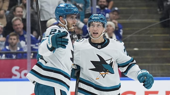 Dec 11, 2025; Toronto, Ontario, CAN; San Jose Sharks forward William Eklund (72) congratulates forward Alex Wennberg (21) after a scoring a goal against the Toronto Maple Leafs in overtime to win the game at Scotiabank Arena. Mandatory Credit: John E. Sokolowski-Imagn Images
