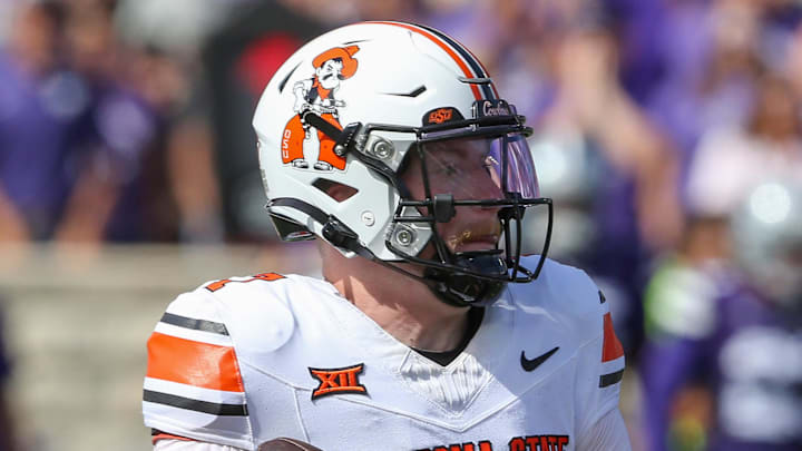 Sep 28, 2024; Manhattan, Kansas, USA; Oklahoma State Cowboys quarterback Alan Bowman (7) drops back to pass against the Kansas State Wildcats during the second quarter at Bill Snyder Family Football Stadium. Mandatory Credit: Scott Sewell-Imagn Images