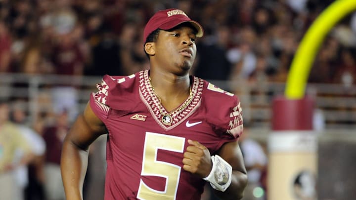 Sep 20, 2014; Tallahassee, FL, USA; Florida State Seminoles quarterback Jameis Winston (5) runs on to the field after halftime before the start of the second half of the game against the Clemson Tigers at Doak Campbell Stadium. Mandatory Credit: Melina Vastola-Imagn Images