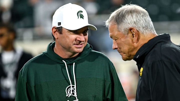 Michigan State head coach Jonathan Smith talks with Iowa head coach Kirk Ferentz before the game Saturday, Oct. 19, 2024, at Spartan Stadium in East Lansing. Michigan State head coach Jonathan Smith talks with Iowa head coach Kirk Ferentz before the game Saturday, Oct. 19, 2024, at Spartan Stadium in East Lansing.
