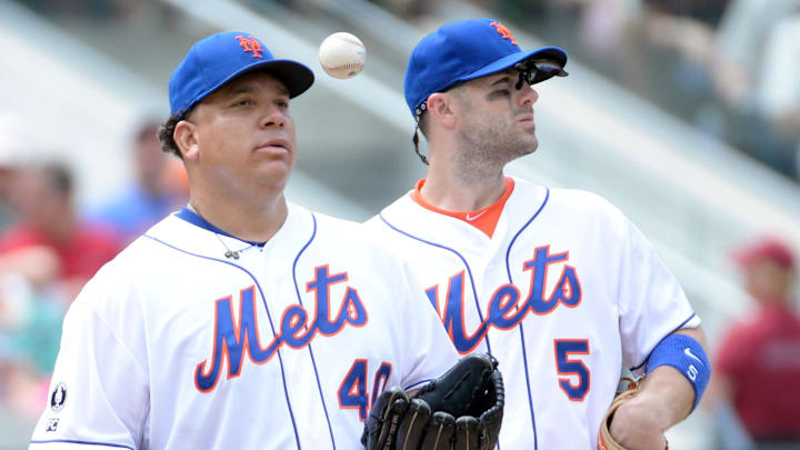 Aug 3, 2014; New York, NY, USA; New York Mets starting pitcher Bartolo Colon (40) gets pulled from the game in the 5th inning against the San Francisco Giants as New York Mets third baseman David Wright (5) waits on the manager at Citi Field. Mandatory Credit: Robert Deutsch-Imagn Images