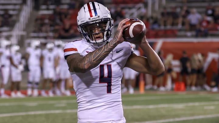 Sep 28, 2024; Salt Lake City, Utah, USA; Arizona Wildcats wide receiver Tetairoa McMillan (4) warms up before a game against the Utah Utes at Rice-Eccles Stadium.