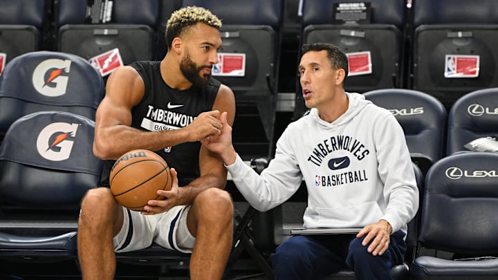 Oct 21, 2022; Minneapolis, Minnesota, USA; Minnesota Timberwolves center Rudy Gobert (27) chats with assistant coach Pablo Prigioni before a game against the Utah Jazz at Target Center.