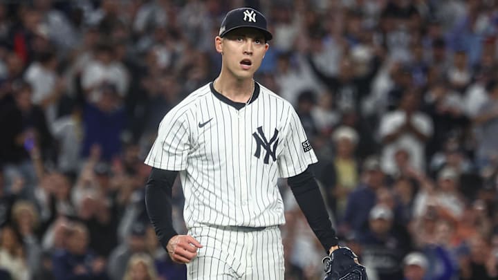 Oct 5, 2024; Bronx, New York, USA; New York Yankees pitcher Luke Weaver (30) reacts after recording a strike out during the ninth inning against the Kansas City Royals during game one of the ALDS for the 2024 MLB Playoffs at Yankee Stadium. Mandatory Credit: Vincent Carchietta-Imagn Images Oct 5, 2024; Bronx, New York, USA; New York Yankees pitcher Luke Weaver (30) reacts after recording a strike out during the ninth inning against the Kansas City Royals during game one of the ALDS for the 2024 MLB Playoffs at Yankee Stadium. Mandatory Credit: Vincent Carchietta-Imagn Images