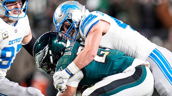Detroit Lions linebacker Jack Campbell (46) tackles Philadelphia Eagles running back Saquon Barkley (26) during the first half at Lincoln Financial Field in Philadelphia on Sunday, November 16, 2025.