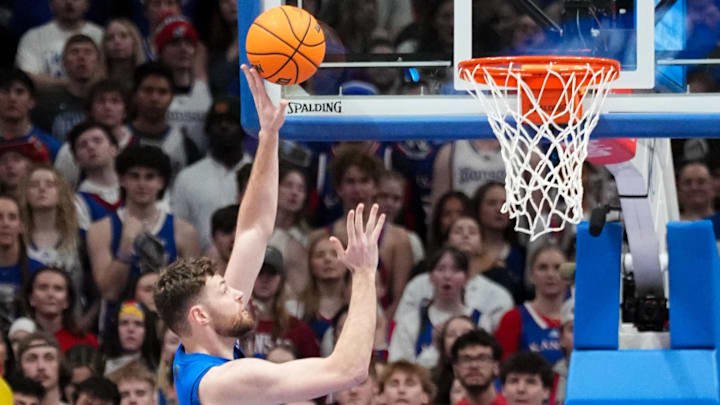 Feb 11, 2025; Lawrence, Kansas, USA; Kansas Jayhawks center Hunter Dickinson (1) scores against the Colorado Buffaloes during the first half at Allen Fieldhouse. Mandatory Credit: Denny Medley-Imagn Images Feb 11, 2025; Lawrence, Kansas, USA; Kansas Jayhawks center Hunter Dickinson (1) scores against the Colorado Buffaloes during the first half at Allen Fieldhouse. Mandatory Credit: Denny Medley-Imagn Images