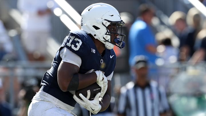 Penn State running back Kaytron Allen (13) carries the ball during the fourth quarter against the UCLA Bruins at Beaver Stadium.