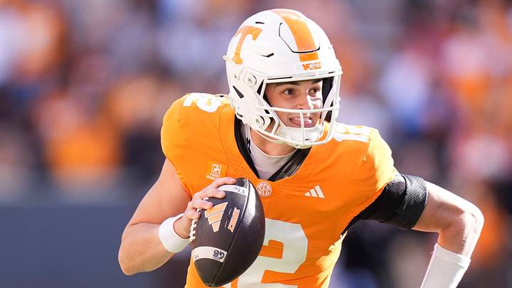 Tennessee quarterback George MacIntyre (12) scrambles with the ball during a game between Tennessee and Alabama in Neyland Stadium in Knoxville, Tenn., Oct. 17, 2026.