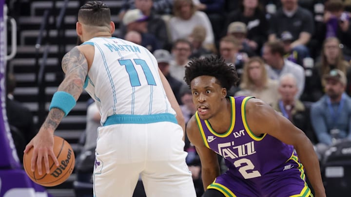 Feb 22, 2024; Salt Lake City, Utah, USA;  Utah Jazz guard Collin Sexton (2) focuses on the ball controlled by Charlotte Hornets forward Cody Martin (11) during the first quarter at Delta Center. Mandatory Credit: Chris Nicoll-Imagn Images
