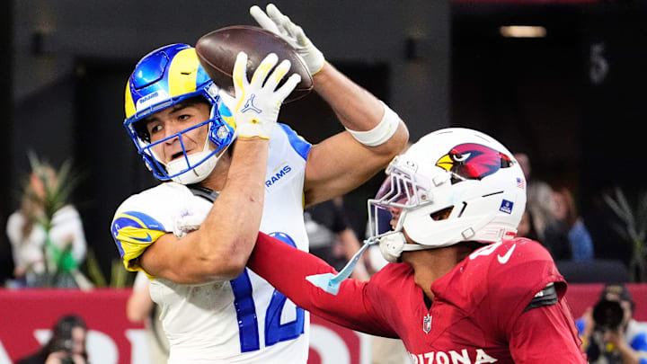 Los Angeles Rams wide receiver Puka Nacua (12) makes a touchdown catch over Arizona Cardinals cornerback Will Johnson (0) in the second half at State Farm Stadium on Dec 7, 2025, in Glendale, Ariz.