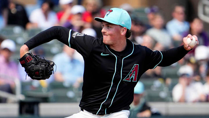 Arizona Diamondbacks starting pitcher Tommy Henry throws to the Kansas City Royals in the first inning during a spring training game at Salt River Fields in Scottsdale on March 14, 2024.