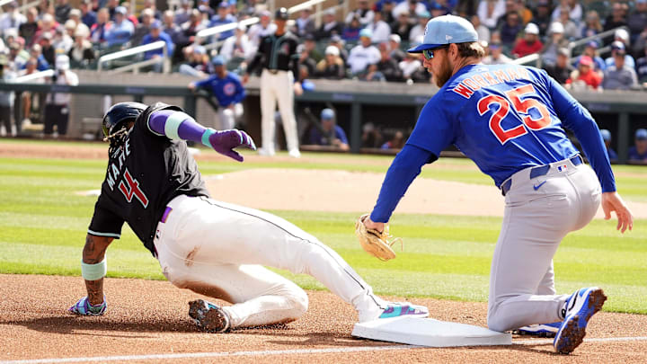 Arizona Diamondbacks Ketel Marte slides safely in third base under the tag by Chicago Cubs Gage Workman in the first inning during a spring training game at Salt River Fields on March 3, 2025. Arizona Diamondbacks Ketel Marte slides safely in third base under the tag by Chicago Cubs Gage Workman in the first inning during a spring training game at Salt River Fields on March 3, 2025.