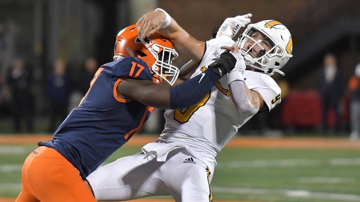 Sep 22, 2022; Champaign, Illinois, USA; Illinois Fighting Illini linebacker Gabe Jacas (17) tackles Chattanooga Mocs quarterback Preston Hutchinson (9) as he passes the ball during the first half at Memorial Stadium. Mandatory Credit: Ron Johnson-Imagn Images