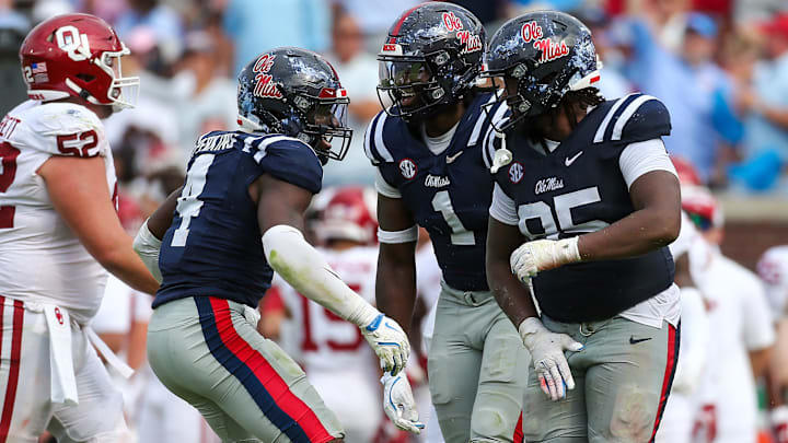 Oct 26, 2024; Oxford, Mississippi, USA; Mississippi Rebels linebacker Suntarine Perkins (4), defensive lineman Princely Umanmielen (1) and defensive lineman Akelo Stone (95) reacts after a sack during the second half against the Oklahoma Sooners at Vaught-Hemingway Stadium. Mandatory Credit: Petre Thomas-Imagn Images Oct 26, 2024; Oxford, Mississippi, USA; Mississippi Rebels linebacker Suntarine Perkins (4), defensive lineman Princely Umanmielen (1) and defensive lineman Akelo Stone (95) reacts after a sack during the second half against the Oklahoma Sooners at Vaught-Hemingway Stadium. Mandatory Credit: Petre Thomas-Imagn Images