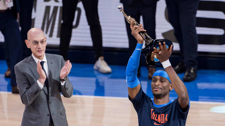 NBA commissioner Adam Silver presents Oklahoma City Thunder guard Gilgeous-Alexander (2) with the Michael Jordan Trophy for winning the most valuable player award for the 2024-25 season.
