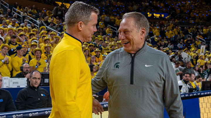 Michigan State’s Tom Izzo smiles as he greets Michigan’s Dusty May before their rivalry matchup game at Crisler Center in Ann Arbor, on Friday, Feb. 21, 2025.