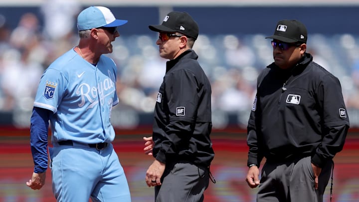 Apr 18, 2026; Bronx, New York, USA; Kansas City Royals manager Matt Quatraro (33) argues with first base umpire Chris Guccione (68) and second base umpire Nestor Ceja (33) after being ejected from the game against the New York Yankees during the first inning at Yankee Stadium. Mandatory Credit: Brad Penner-Imagn Images