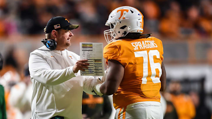 Nov 20, 2021; Knoxville, Tennessee, USA; Tennessee Volunteers head coach Josh Heupel talks with offensive lineman Javontez Spraggins (76) during the first half against the South Alabama Jaguars at Neyland Stadium. Mandatory Credit: Bryan Lynn-Imagn Images