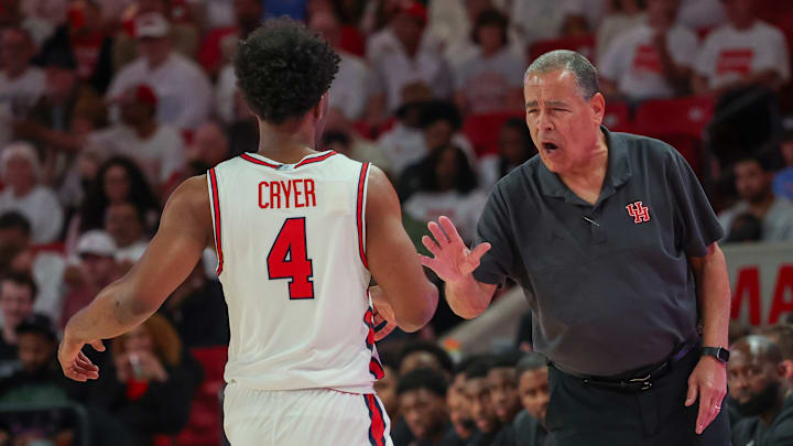 Houston coach Kelvin Sampson (right) congratulates guard LJ Cryer during a recent game. Houston coach Kelvin Sampson (right) congratulates guard LJ Cryer during a recent game.
