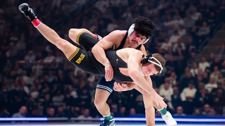 Penn State’s Beau Bartlett takes down Iowa's Cullan Schriever in the 141-pound bout during a Big Ten wrestling match at the Bryce Jordan Center. Penn State’s Beau Bartlett takes down Iowa's Cullan Schriever in the 141-pound bout during a Big Ten wrestling match at the Bryce Jordan Center.