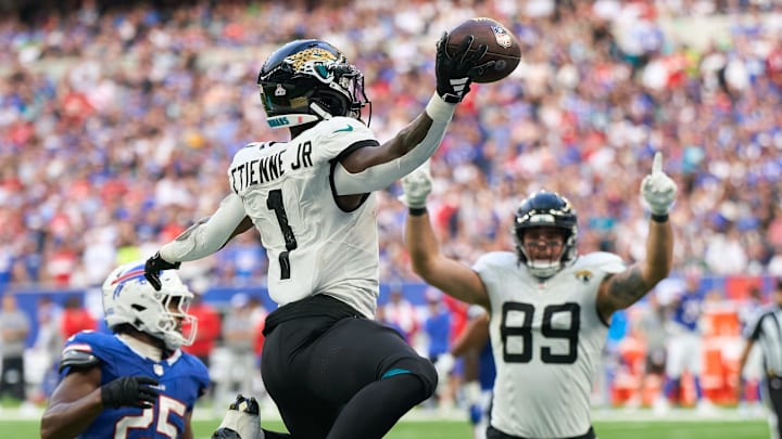 Oct 8, 2023; London, United Kingdom;  Jacksonville Jaguars running back Travis Etienne Jr. (1) jumps