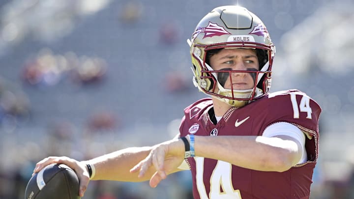 Nov 23, 2024; Tallahassee, Florida, USA; Florida State Seminoles quarterback Luke Kromenhoek (14) warms up before the game against the Charleston Southern Buccaneers at Doak S. Campbell Stadium. Mandatory Credit: Melina Myers-Imagn Images
