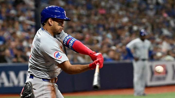 Jun 11, 2024; St. Petersburg, Florida, USA; Chicago Cubs third baseman Christopher Morel (5) hits a single in the sixth inning against the Tampa Bay Rays at Tropicana Field. Mandatory Credit: Jonathan Dyer-USA TODAY Sports