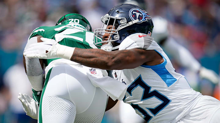 Tennessee Titans linebacker Ernest Jones IV (53) tackles New York Jets running back Breece Hall (20) during the first quarter at Nissan Stadium in Nashville, Tenn., Sunday, Sept. 15, 2024.