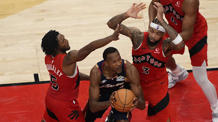 Nov 24, 2025; Toronto, Ontario, CAN; Toronto Raptors guard Immanuel Quickley (5) and forward Brandon Ingram (3) defend against Cleveland Cavaliers forward Evan Mobley (4) during the second half at Scotiabank Arena. Mandatory Credit: John E. Sokolowski-Imagn Images Nov 24, 2025; Toronto, Ontario, CAN; Toronto Raptors guard Immanuel Quickley (5) and forward Brandon Ingram (3) defend against Cleveland Cavaliers forward Evan Mobley (4) during the second half at Scotiabank Arena. Mandatory Credit: John E. Sokolowski-Imagn Images