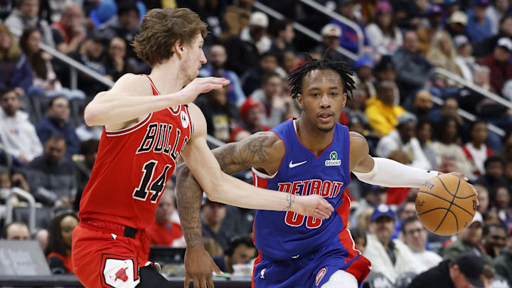 Feb 2, 2025; Detroit, Michigan, USA; Detroit Pistons forward Ronald Holland II (00) dribbles defended by Chicago Bulls forward Matas Buzelis (14) in the second half at Little Caesars Arena. Mandatory Credit: Rick Osentoski-Imagn Images