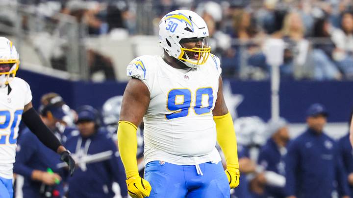Dec 21, 2025; Arlington, Texas, USA; Los Angeles Chargers defensive tackle Teair Tart (90) reacts after a tackle for a loss against the Dallas Cowboys during the third quarter at AT&T Stadium. Mandatory Credit: Kevin Jairaj-Imagn Images