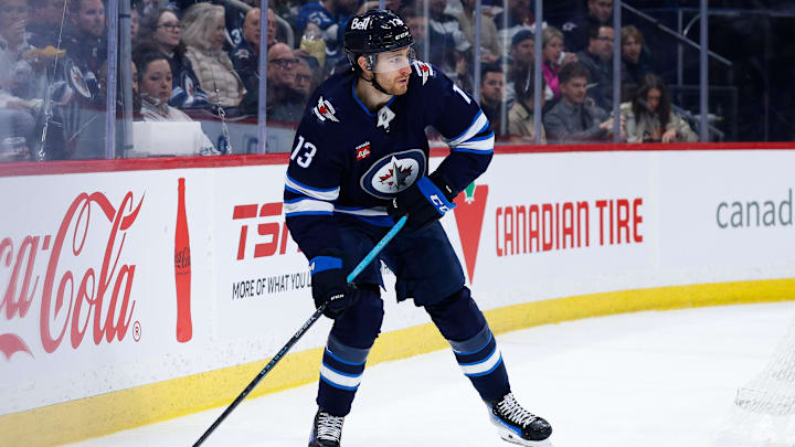 Jan 10, 2025; Winnipeg, Manitoba, CAN; Winnipeg Jets forward Gabriel Vilardi (13) looks to make a pass against the Los Angeles Kings during the second period at Canada Life Centre. Mandatory Credit: Terrence Lee-Imagn Images