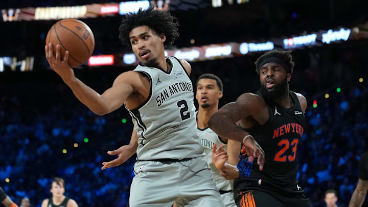 Dec 16, 2025; Las Vegas, Nevada, USA; San Antonio Spurs guard Dylan Harper (2) grabs a rebound against the New York Knicks in the second half during the Emirates NBA Cup Final at T-Mobile Arena. Mandatory Credit: Kirby Lee-Imagn Images