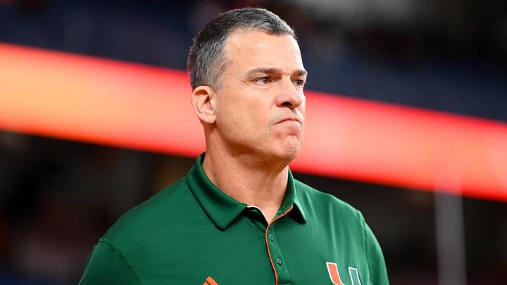 Nov 30, 2024; Syracuse, New York, USA; Miami Hurricanes head coach Mario Cristobal looks on prior to the game against the Syracuse Orange at the JMA Wireless Dome. Mandatory Credit: Rich Barnes-Imagn Images Nov 30, 2024; Syracuse, New York, USA; Miami Hurricanes head coach Mario Cristobal looks on prior to the game against the Syracuse Orange at the JMA Wireless Dome. Mandatory Credit: Rich Barnes-Imagn Images
