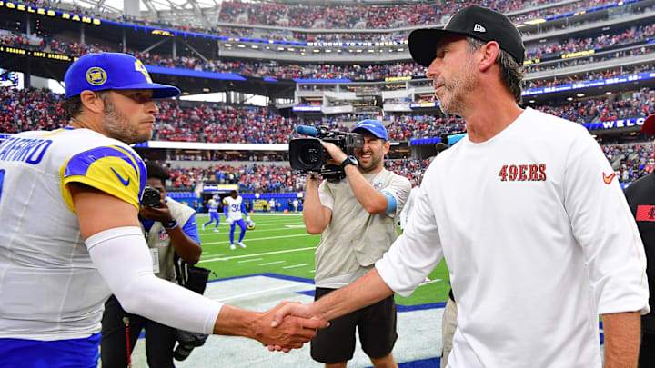 Sep 22, 2024; Inglewood, California, USA; Los Angeles Rams quarterback Matthew Stafford (9) meets with San Francisco 49ers head coach Kyle Shanahan following the victory at SoFi Stadium. Mandatory Credit: Gary A. Vasquez-Imagn Images