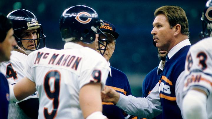 Jan 26, 1986; New Orleans, LA, USA; FILE PHOTO; Chicago Bears head coach Mike Ditka (right) and offensive coordinator Ed Hughes (center) talk to quarterbacks Jim McMahon (9) and Steve Fuller (4) during Super Bowl XX against the New England Patriots at the Superdome. The Bears defeated the Patriots 46-10. Mandatory Credit: Manny Rubio-USA TODAY Sports